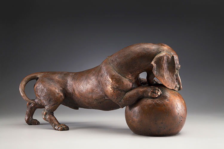 Life's a Ball, MS Life-sized Miniature Smooth Dachshund Bronze Sculpture by Sculptor Joy Beckner